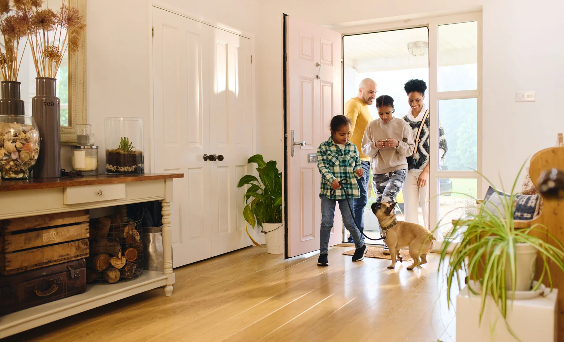 Family entering their home