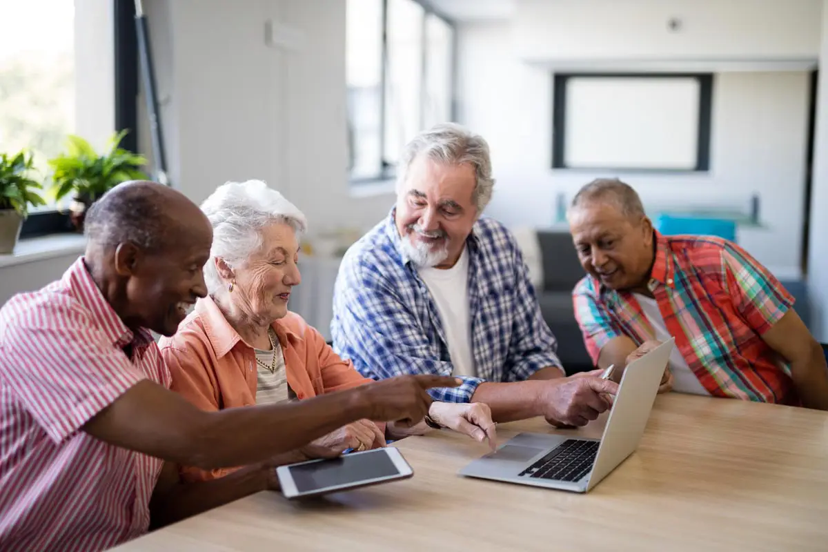 Retirees reviewing reverse mortgage options together