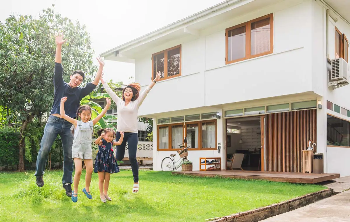 Family celebrating getting the keys to their first home