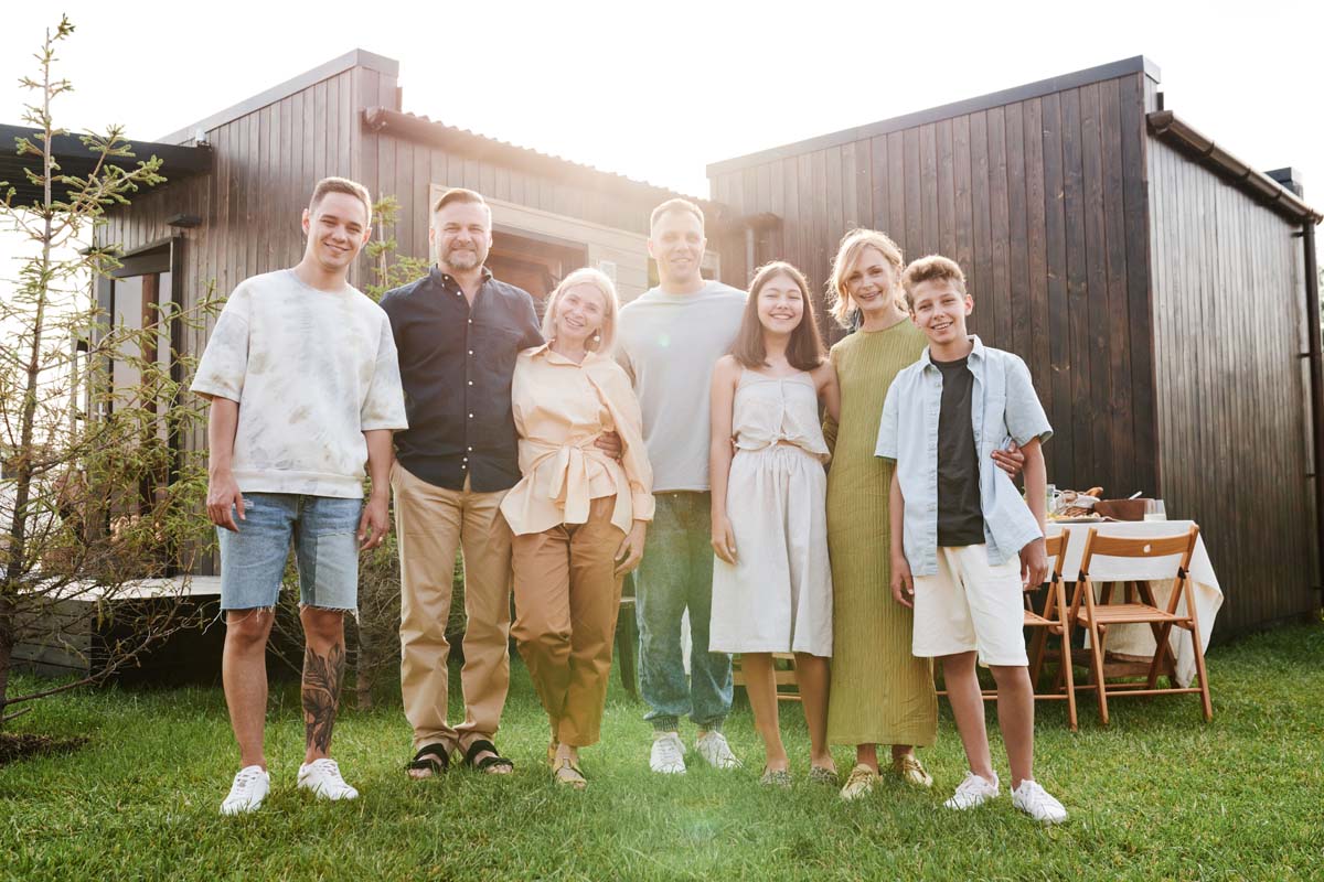 Family outside their modern home