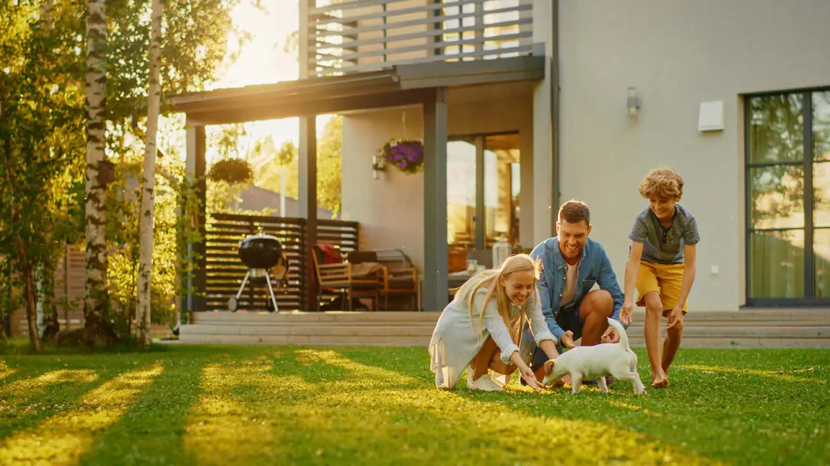 Family enjoying time on the lawn of their home