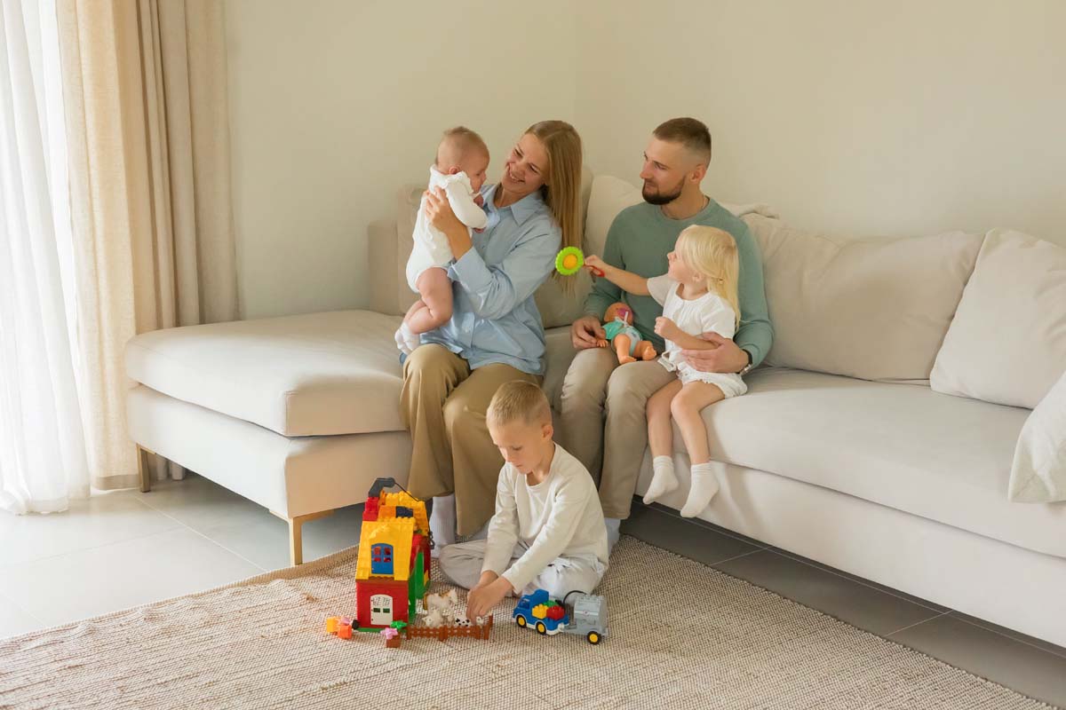 Family relaxing comfortably in their refinanced home