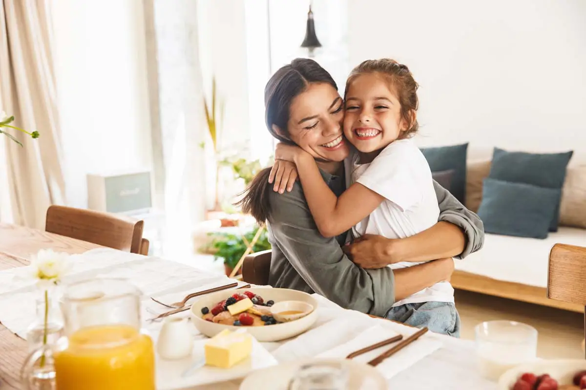 Family sharing a hug at home