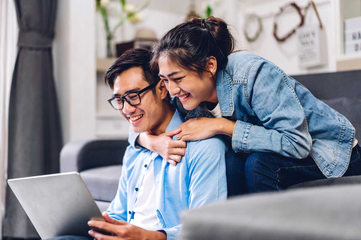 Couple reviewing major expenses and budget at home