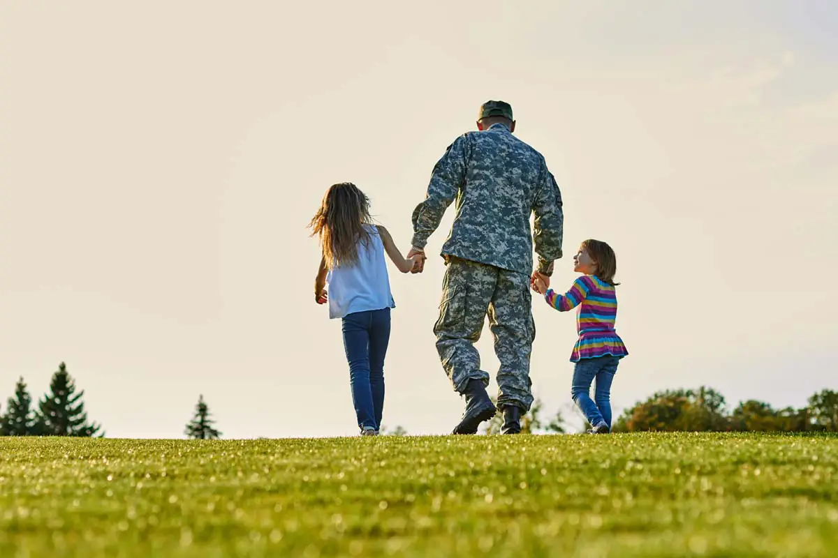Veteran family outside their home